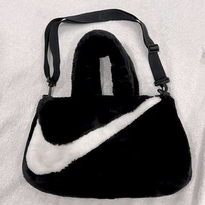 NIKE plush bag, comes with shoulder handle and hand handles.